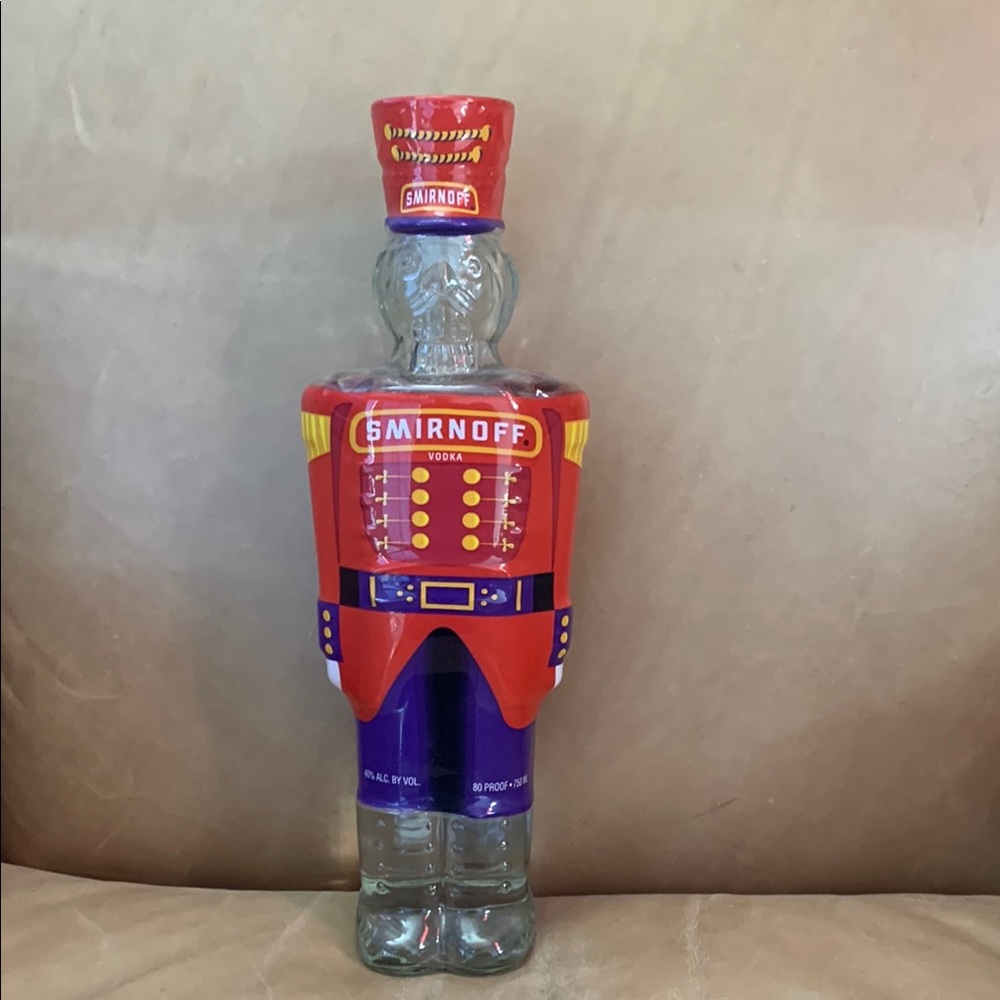Smirnoff Vodka Bottle with Decorative Cover
Bottle has not been open 
Date 1998